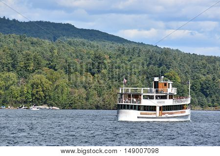 LAKE GEORGE, NY - SEP 24: Cruises around Lake George in New York State, as seen on Sep 24, 2016. The lake lies within the upper region of the Great Appalachian Valley and drains all the way northward into Lake Champlain and the St. Lawrence River drainage