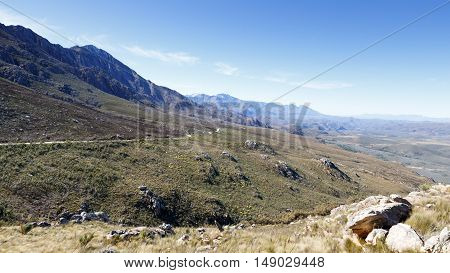Roads Leading To The Middle Of The Swartberg Pass Looking Down At Mountains