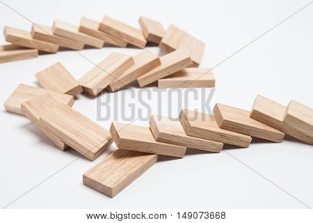 Domino effect - row of white dominoes on white background