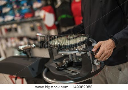 Tennis Stringer Doing Racket Stringing