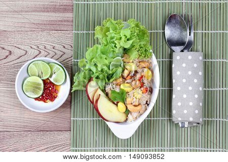 Fried  rice with mixed vegetable as ginko,tofu,corn,lentils,tomato,carrot,taro,mushroom,Lettuce,cashew nut,apple,green lemon and red chili  served with side dish as red chili and green lemon in tofu sauce for Chinese vegetable festival call " J Food Festi