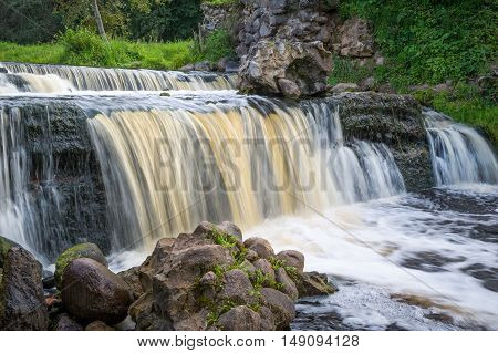 Waterfall of ruined ancient windmill on the river Viata. Belarus, Miorskiy district.