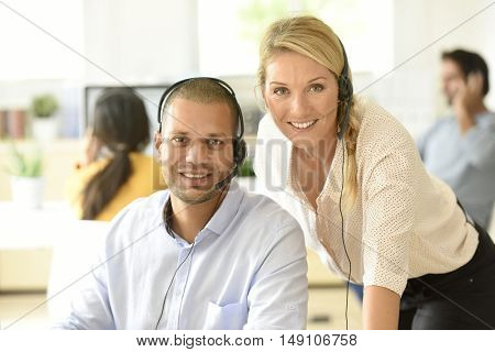 Teleoperator in office with manager