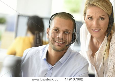 Teleoperator in office with manager