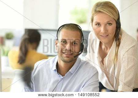 Teleoperator in office with manager