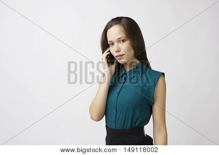 beautiful young woman calling by phone business contract