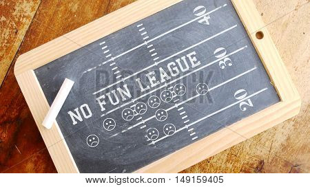 No fun league. American football scheme. Chalk on Blackboard