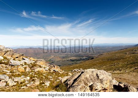 Green Valley Surrounded By Mountains Looking Onto A Plato