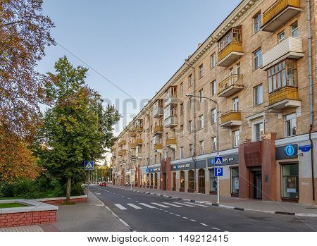 BELGOROD RUSSIA - SEPTEMBER 10 2016: Roadway Holy Trinity Boulevard in the center of Belgorod. Residential house in late Stalin era (mid 20th century).