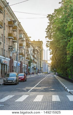 BELGOROD RUSSIA - SEPTEMBER 10 2016: Roadway Holy Trinity Boulevard in the center of Belgorod in the light of the low sun. Houses late Stalin era (mid 20th century) and modern buildings.