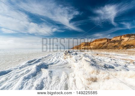 Beautiful winter seascape. Black Sea is covered with ice. The northern coast of the Black Sea region of Odessa Ukraine.