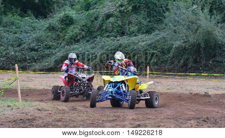 Unidentified Racer Rides A Quad Motorbike.