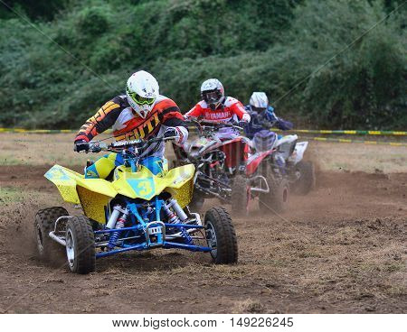 Unidentified Racer Rides A Quad Motorbike.