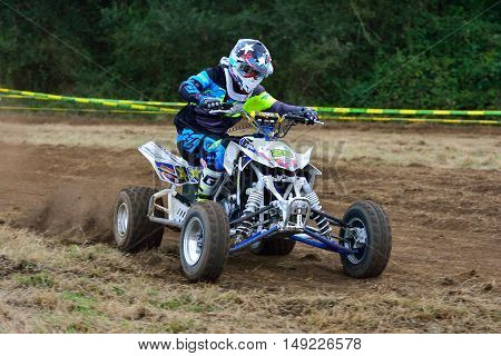Unidentified Racer Rides A Quad Motorbike.