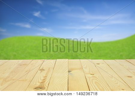 top view or 45 degrees modern and classic vertical wood table or floor for your place object or product on meadow with blue sky background isolated included clipping path