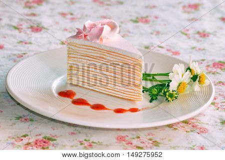 Vanilla Crepe Cake Topping With Strawberry Sauce. It Looks Fresh And Delicious And It Is My Favorite