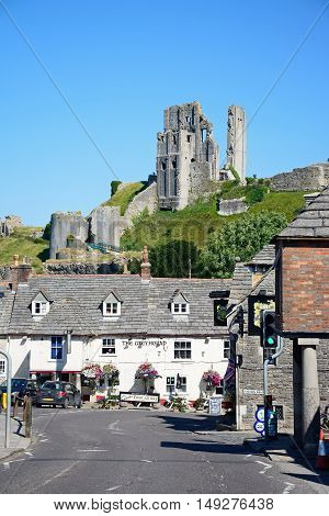 CORFE, UNITED KINGDOM - JULY 19, 2016 - View of Corfe castle seen above The Greyhound Pub Corfe Dorset England UK Western Europe, July 19, 2016.