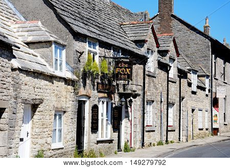 CORFE, UNITED KINGDOM - JULY 19, 2016 - The Fox Inn along a village street Corfe Dorset England UK Western Europe, July 19, 2016.