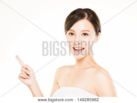 closeup beautiful young woman with pointing gesture