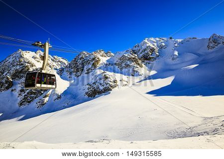Winter landscape with cable car and lift station on the top of swiss mountains with mont Fort on the background, Verbier, 4 Valleys, Switzerland.