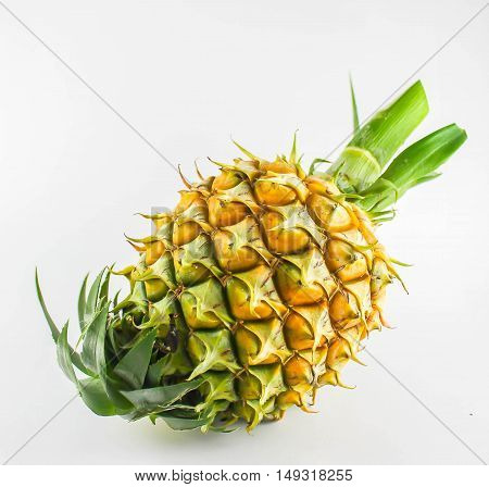 the ripe yellow pineapple on white background
