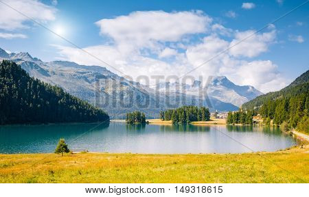 Great view of the azure pond Champfer in alpine valley. Popular tourist attraction. Picturesque and gorgeous scene. Location Swiss alps, Silvaplana village, district of Maloja, Europe. Beauty world.