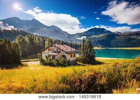 Great view of the azure pond Champfer in alpine valley. Popular tourist attraction. Picturesque and gorgeous scene. Location Swiss alps, Silvaplana village, district of Maloja, Europe. Beauty world.