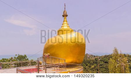 The replica of Phra That In-Kwaen (Hanging Golden Rock) at Koh (islands) Sirey temple Phuket Thailand. It was built by Myanmar Buddhists who works in this region