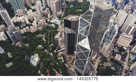 Top view aerial photo from drone of big metropolis city with development urban and transportation infrastructure. Office skyscrapers of Hong Kong world's leading international financial centres