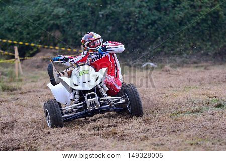 Unidentified Racer Rides A Quad Motorbike.