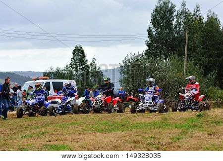Unidentified Racer Rides A Quad Motorbike.