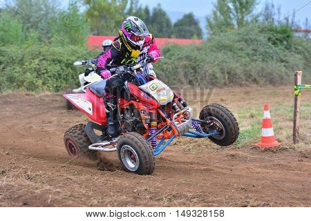 Unidentified Racer Rides A Quad Motorbike.
