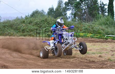 Unidentified Racer Rides A Quad Motorbike.