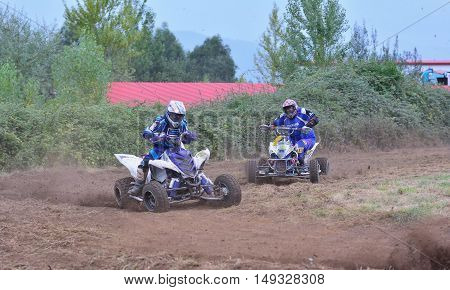 Unidentified Racer Rides A Quad Motorbike.