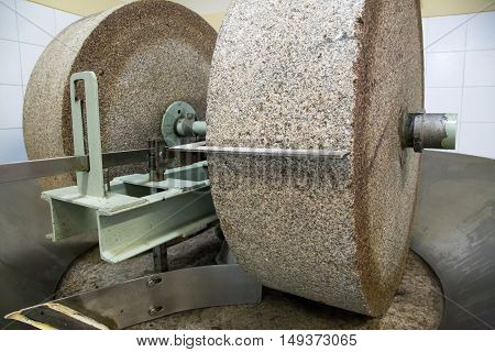 A grinding stone inside an olive oil factory in Mendoza, Argentina