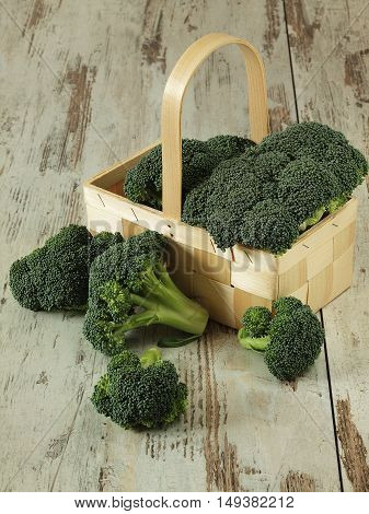 Fresh green broccoli on the wooden backgroundund