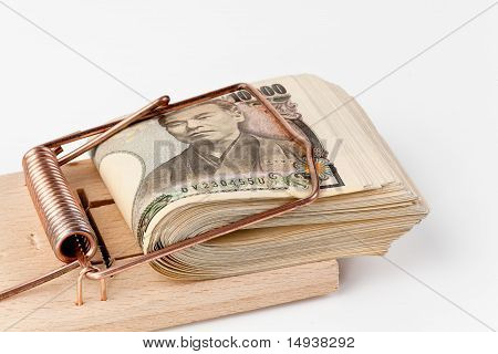 Japanese yen banknotes in mouse trap