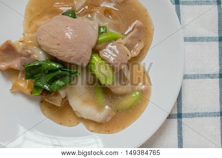 Rad Na, Famous Thai Chinese Style Wide Rice Noodle Dish With Tasty Tender Pork With Thick Gravy Sauc