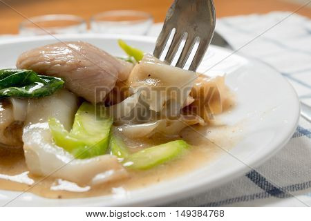 Rad Na, Famous Thai Chinese Style Wide Rice Noodle Dish With Tasty Tender Pork With Thick Gravy Sauc
