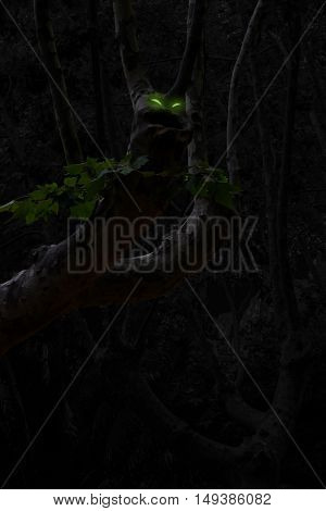 Tree with a large mouth and glowing eyes in the mystery forest