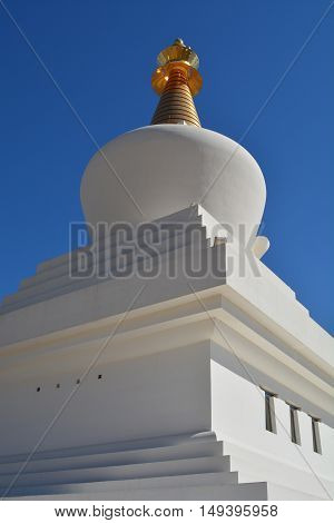 Dome of the Stupa with blue sky background.