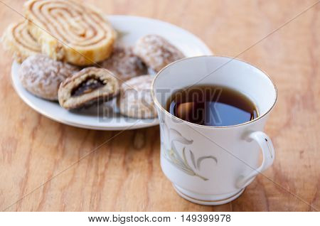A cup of tea close-up on a background of sweet