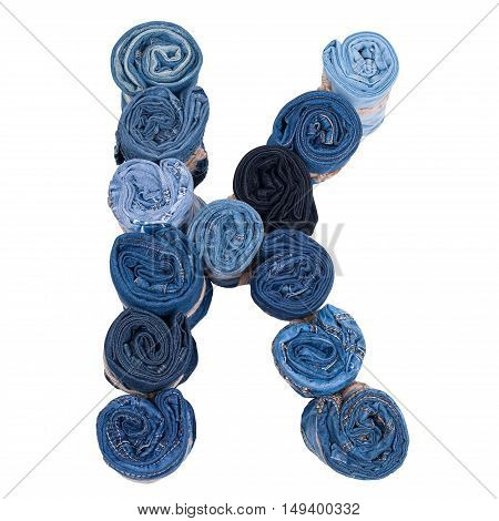 Letter K made of jeans roll on a white background