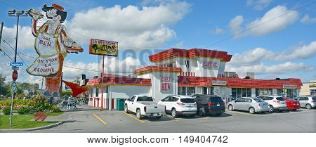 GRANBY QUEBEC CANADA 09 28 2016: Sign of Cantine Ben La Bedaine fast food restaurant some of the best Quebecois comfort food available.