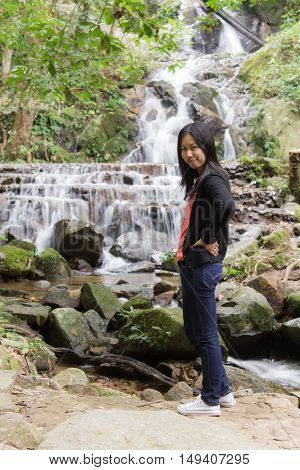 Thai woman with Mae Kam Pong waterfall, Chiangmai Thailand