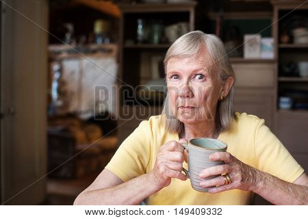 Angry Mature Woman Holding Cup