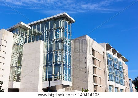 Architectural details of convention center building in Washington DC. The natural light coming through the windows gives a lift to the concrete core structure.