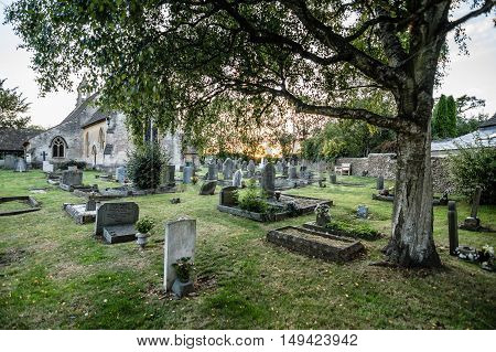 Tetbury UK - August 15 2015: Churchyard of St Saviour Church. Outdoor view at sunset.