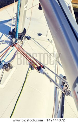A boom vang or kicking strap is a line or piston system on a sailboat used to exert downward force on the boom and thus control the shape of the sail.