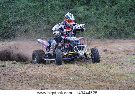 Unidentified Racer Rides A Quad Motorbike.